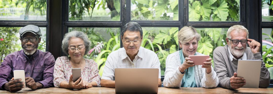 group of school retirees' using computers